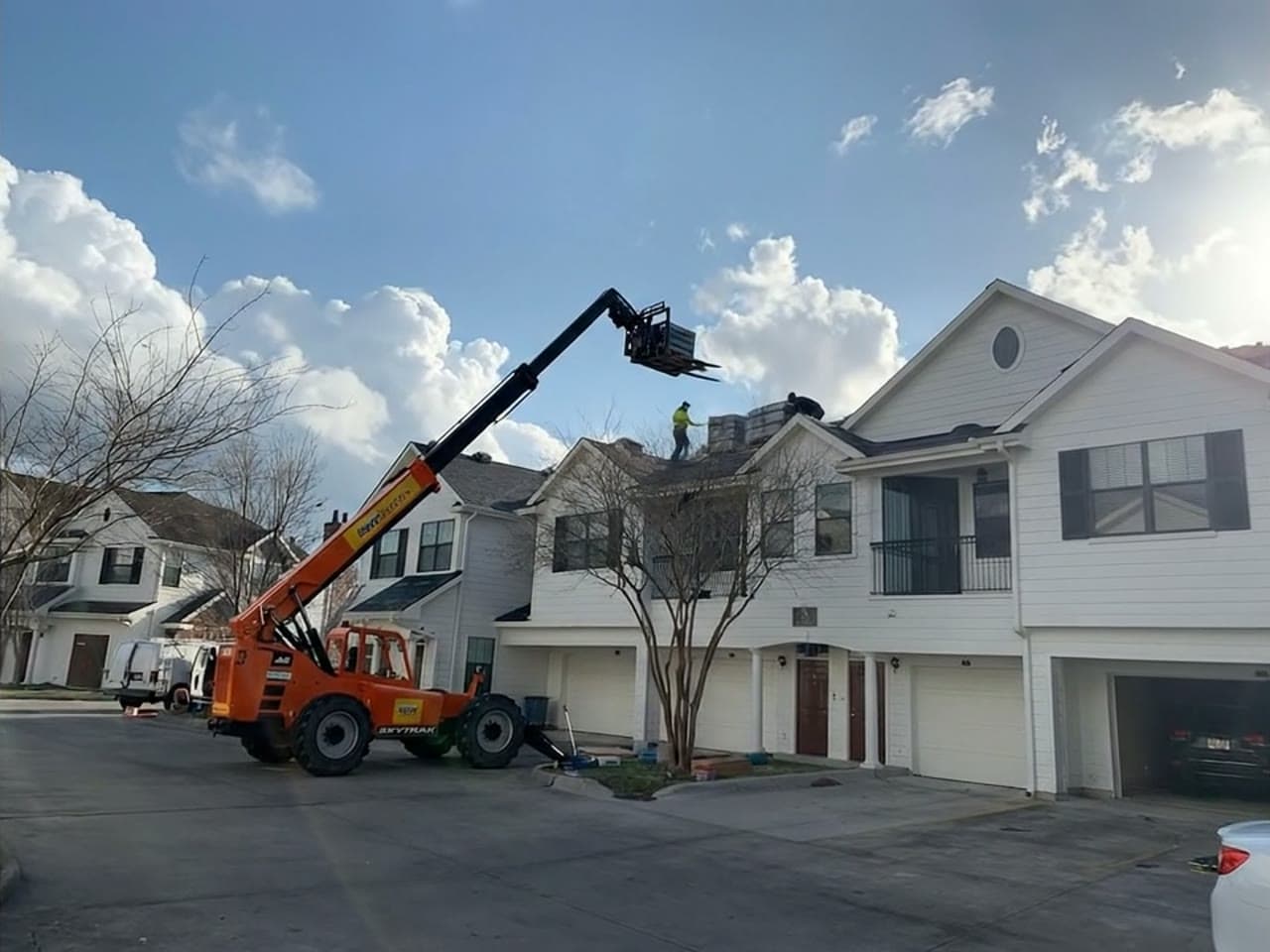 An Edwards Roofing crew replacing a roof